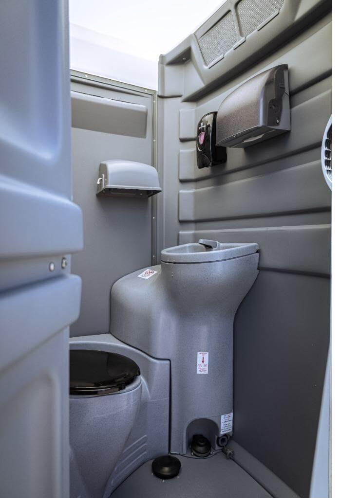 Colorful VIP-style portable restroom units for a private party